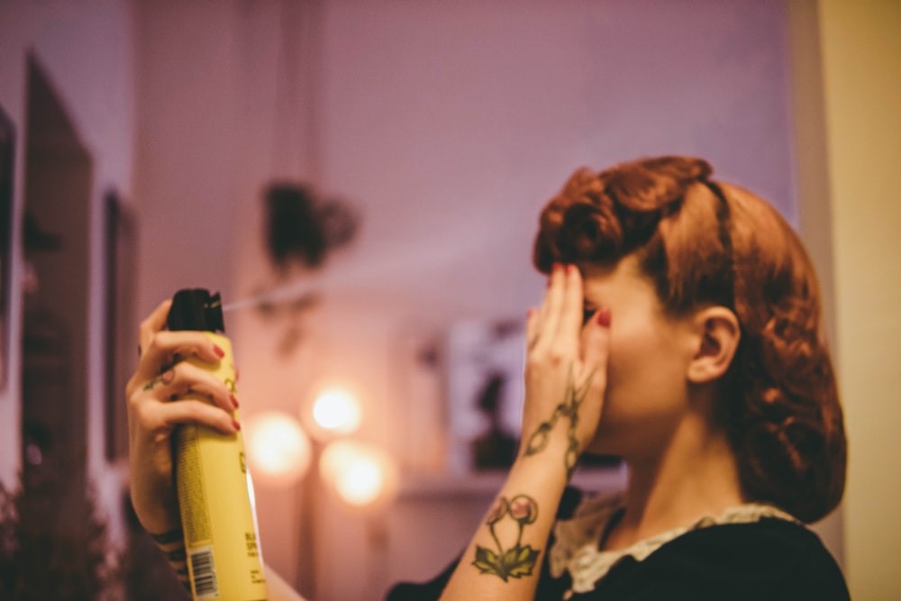 A woman setting her vintage hairstyle