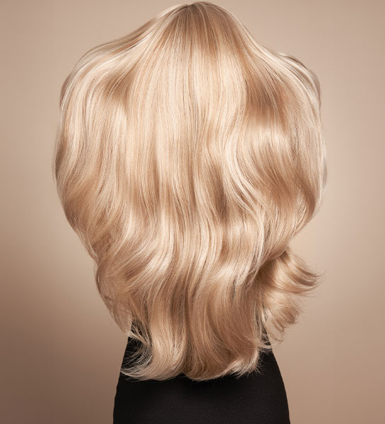 Blonde, long-lasting hair extensions on a client in The Woodlands.