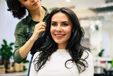 A long-lasting hair extensions client in The Woodlands gets a hair consultation.