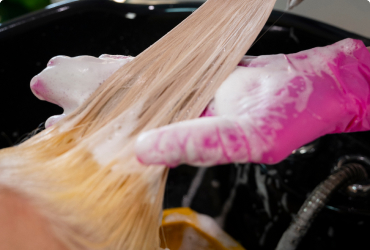 A client from The Woodlands has her I-Tip hair extensions blended.