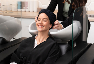 A woman from The Woodlands has her long-lasting hair extensions styled.