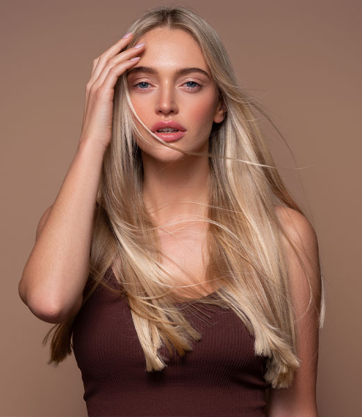 A beautiful The Woodlands client shows her blonde European and Russian hair extensions.