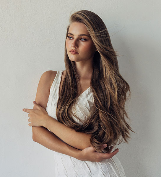 A client gets long-lasting hair extensions installed in Spring, TX